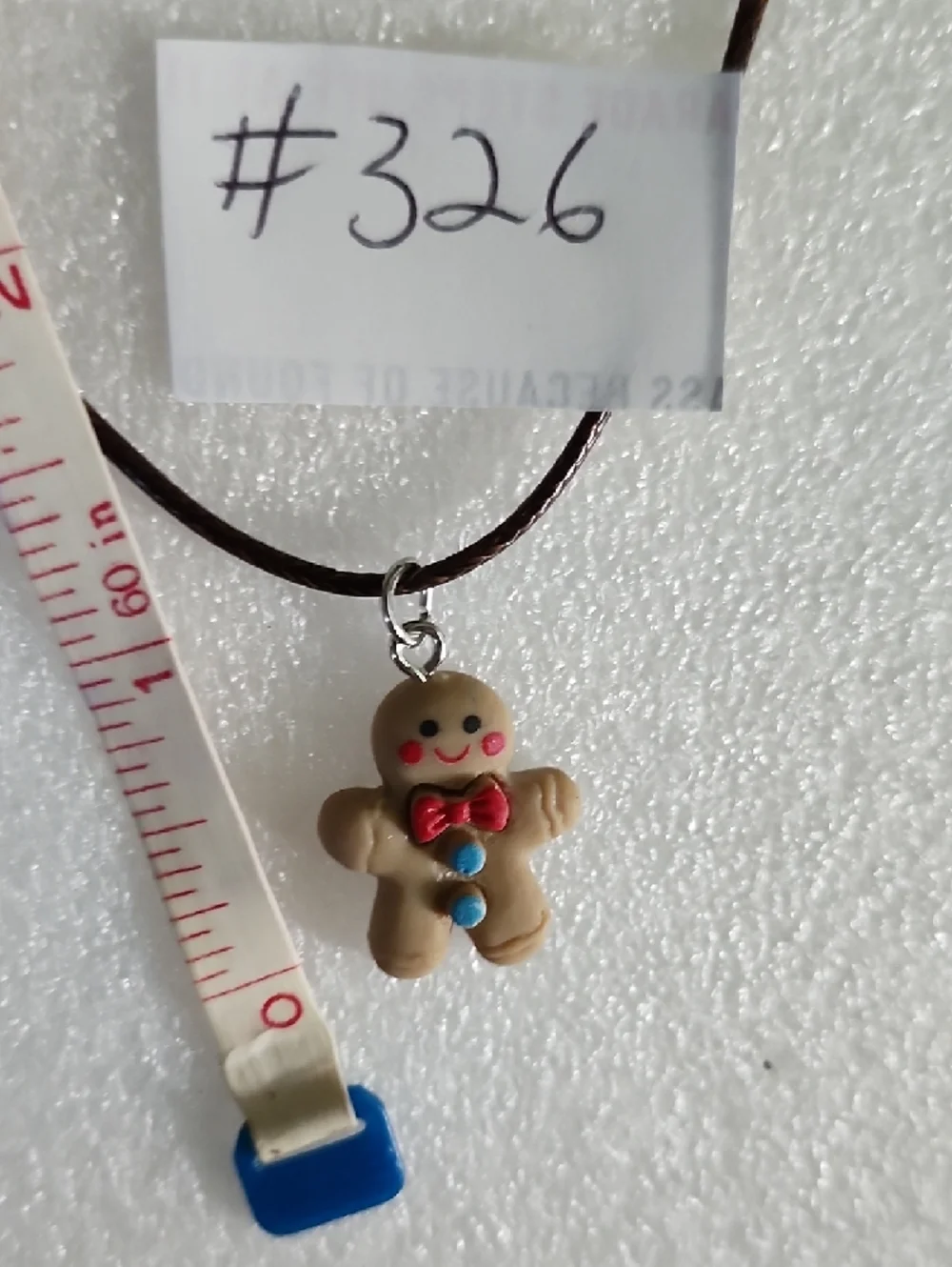 Hand Crafted Brown Gingerbread Man Necklace with Red and Blue Accents
